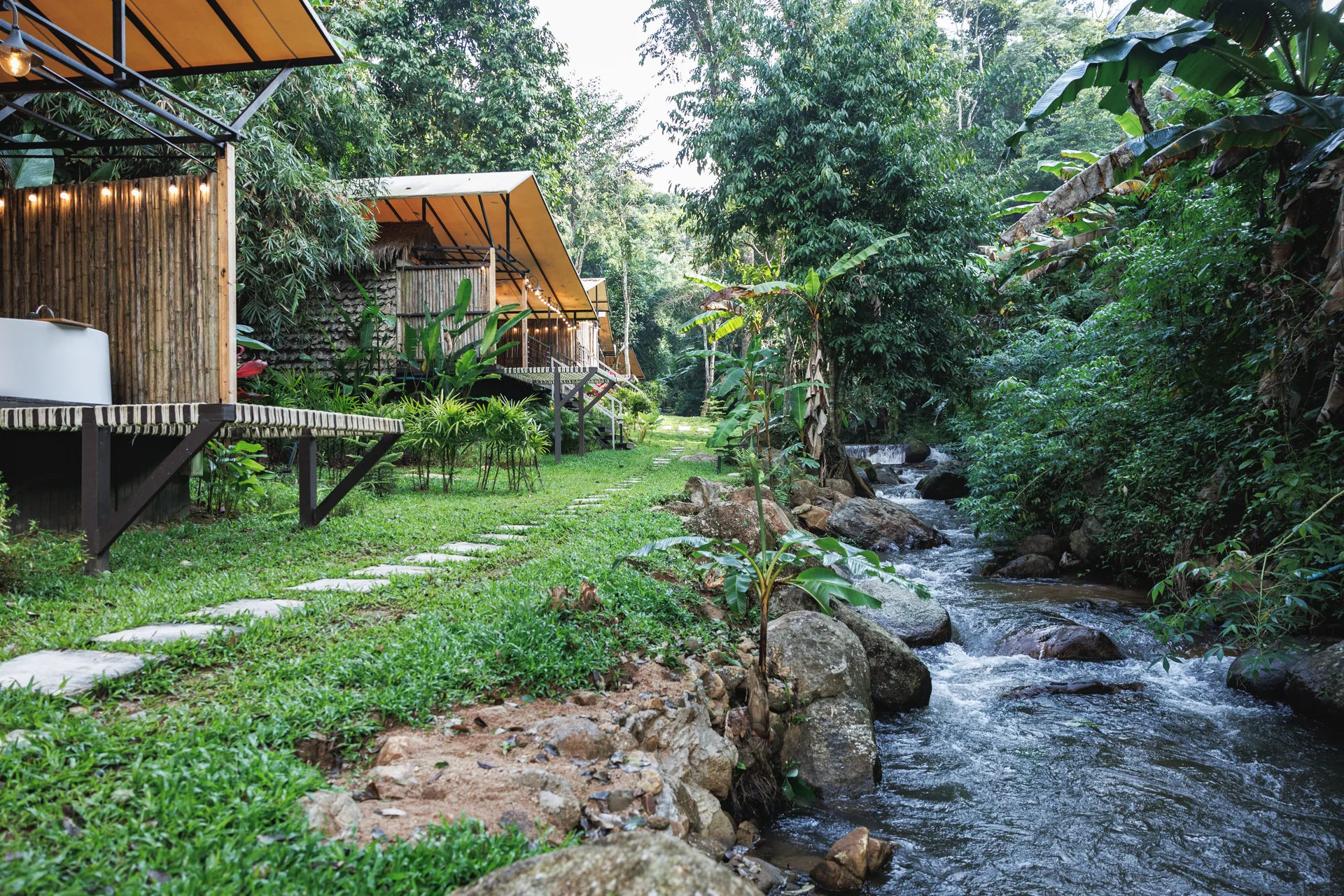 Mornery's tented rooms and outdoor baths beside a forest stream